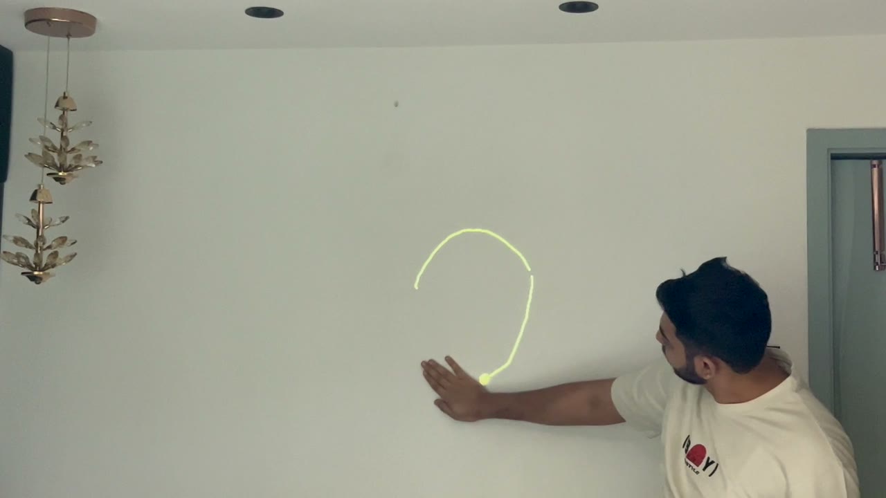 Drawing a heart on the wall with a hand